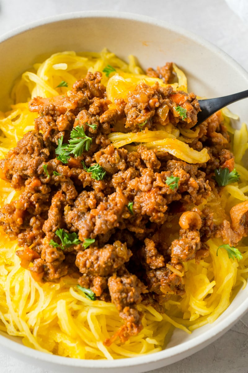 Paleo Spaghetti Squash Bolognese recipe from RecipeGirl.com #paleo #spaghetti #squash #spaghettisquash #bolognese #recipe #RecipeGirl Bowl of Paleo Spaghetti Squash Bolognese