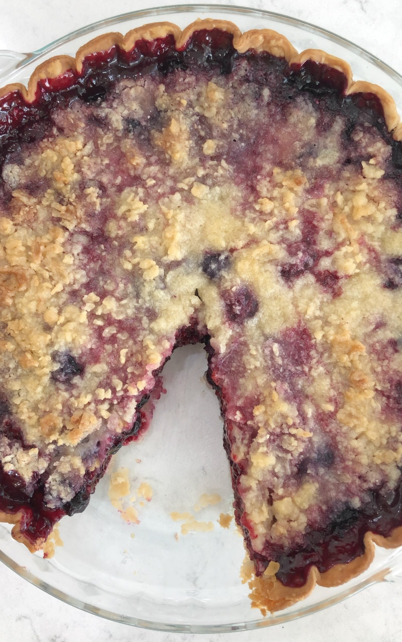 Slice taken out of Three Berry Pie