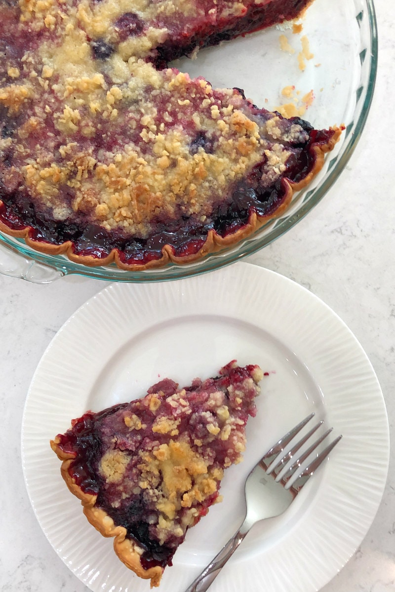 Slice of three berry pie