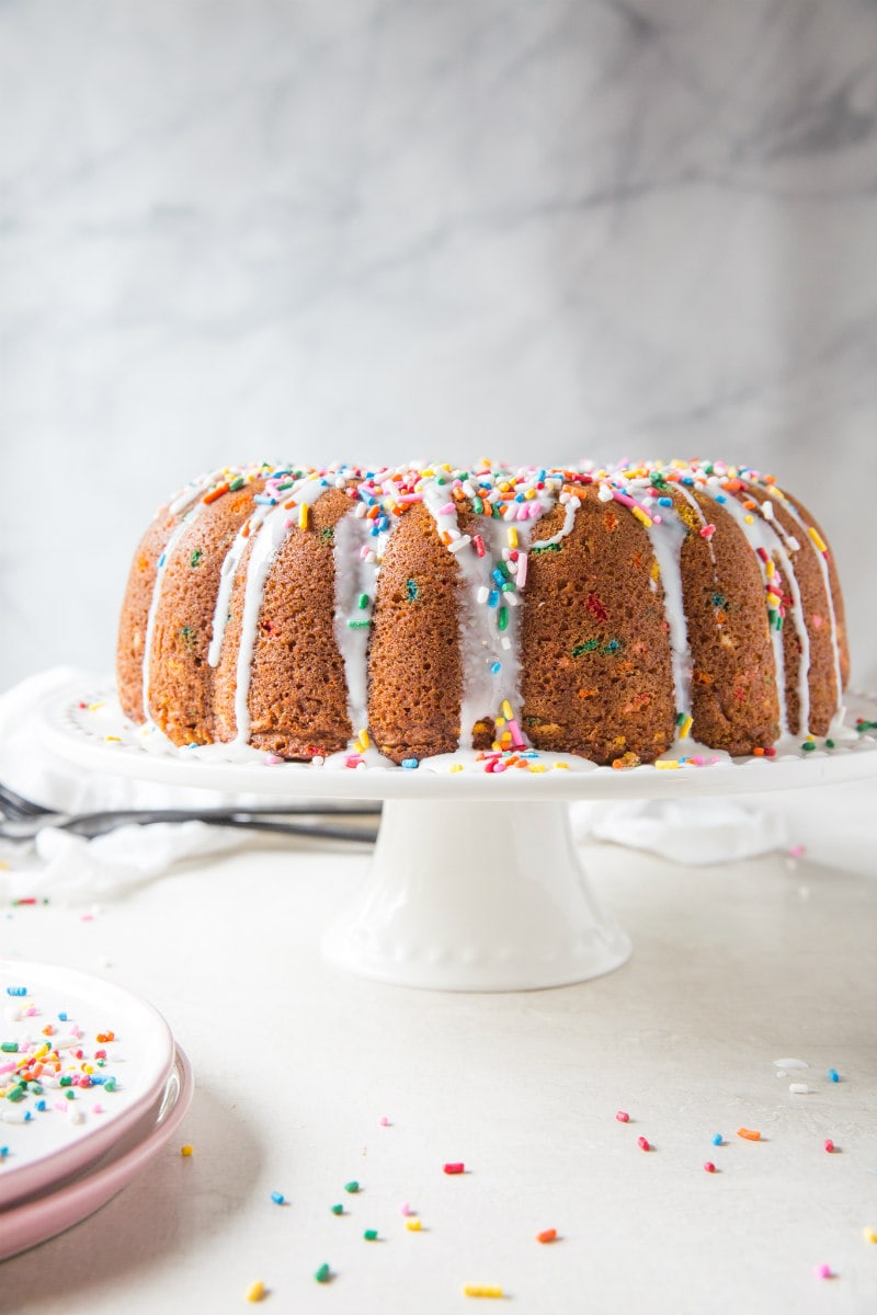 Funfetti Bundt Cake drizzled with white chocolate glaze