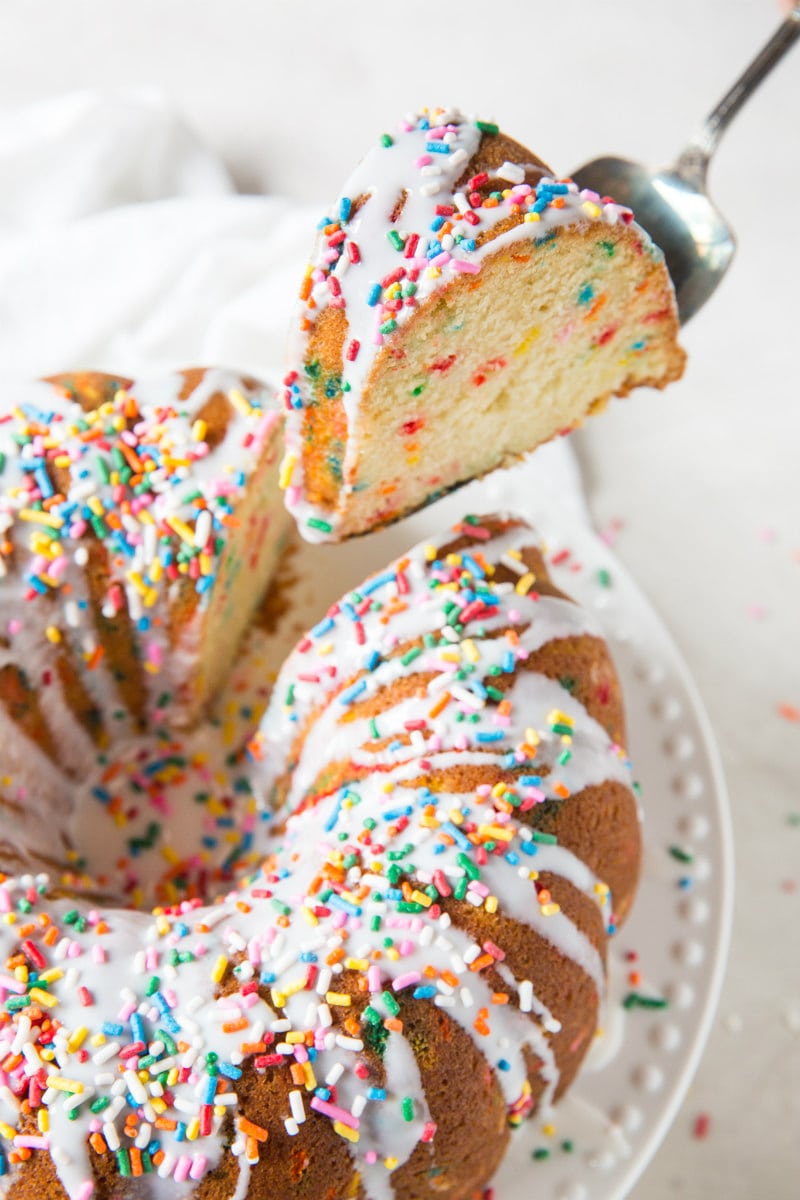 Cutting a slice of the Funfetti Bundt Cake