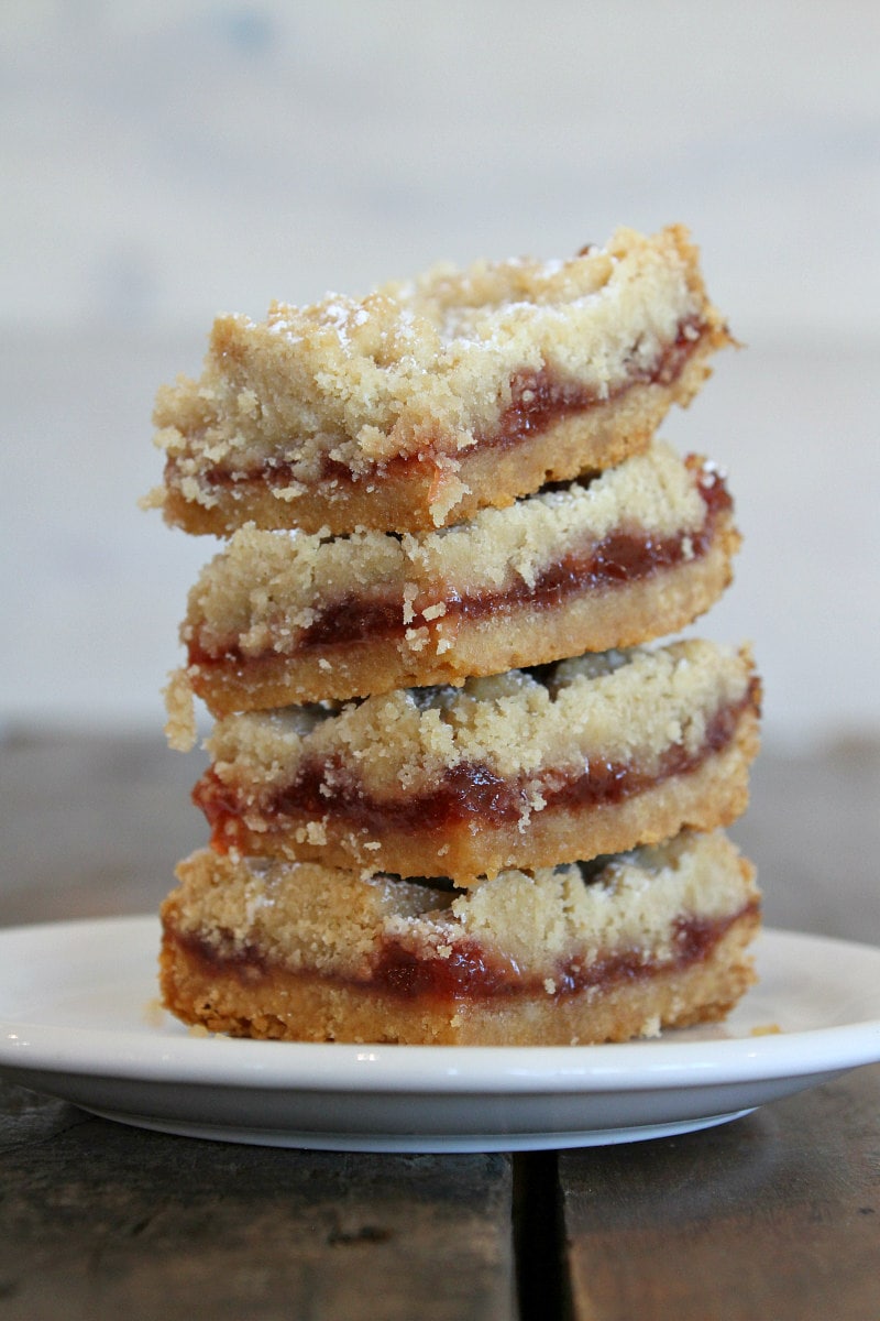 stack of Strawberry Shortbread Bars on a white plate