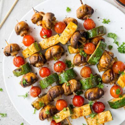 chipotle glazed vegetable kabobs on a white plate