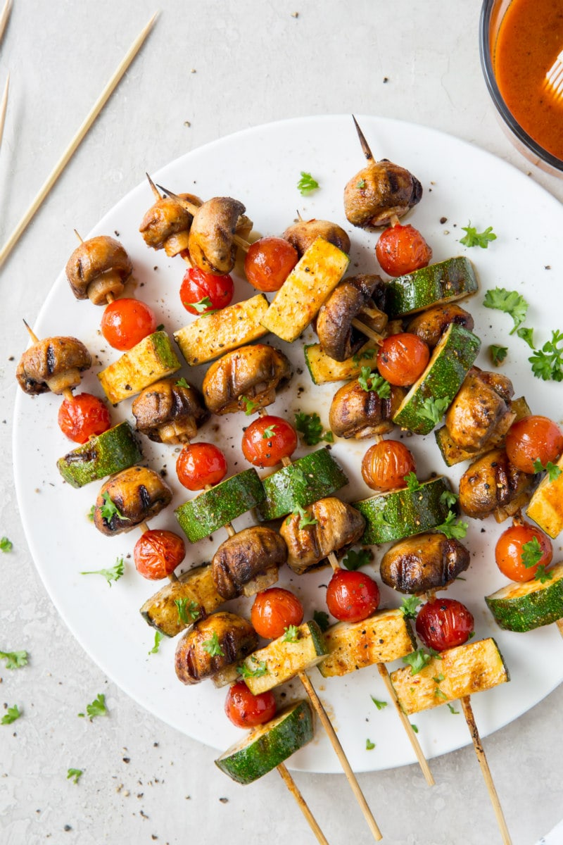 chipotle glazed vegetable kabobs on a white plate