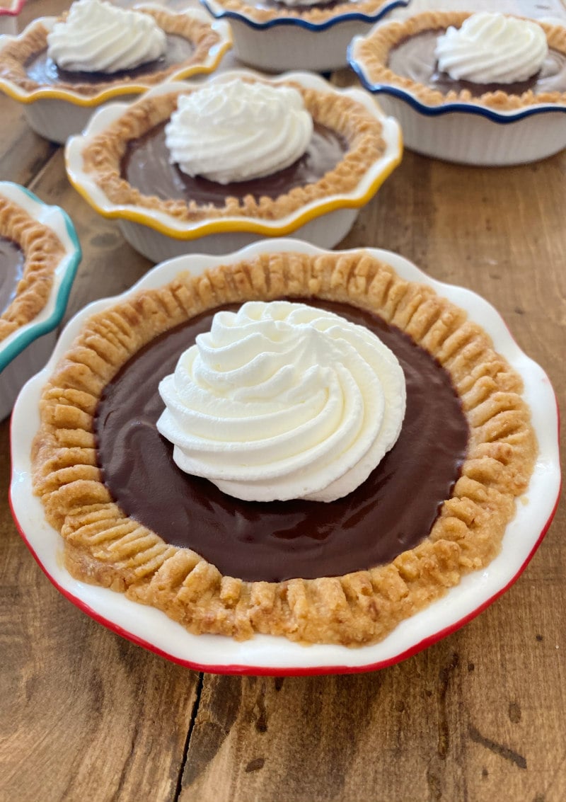 Mini Chocolate Cream Pies topped with whipped cream
