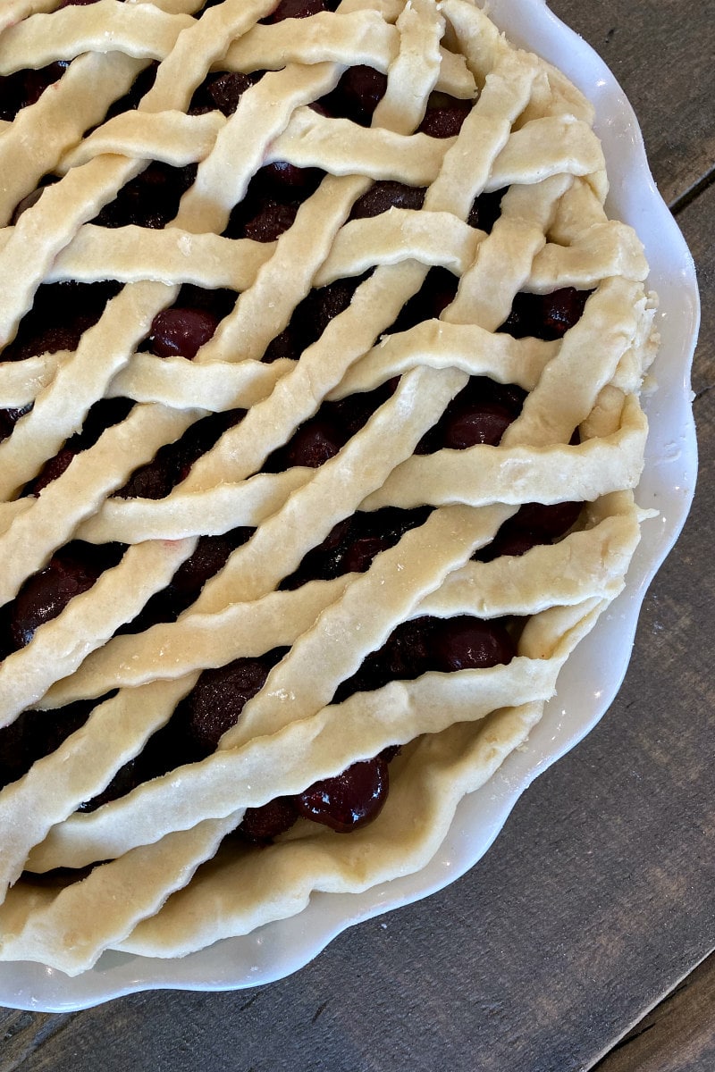 making Cherry Amaretto Pie with a lattice crust