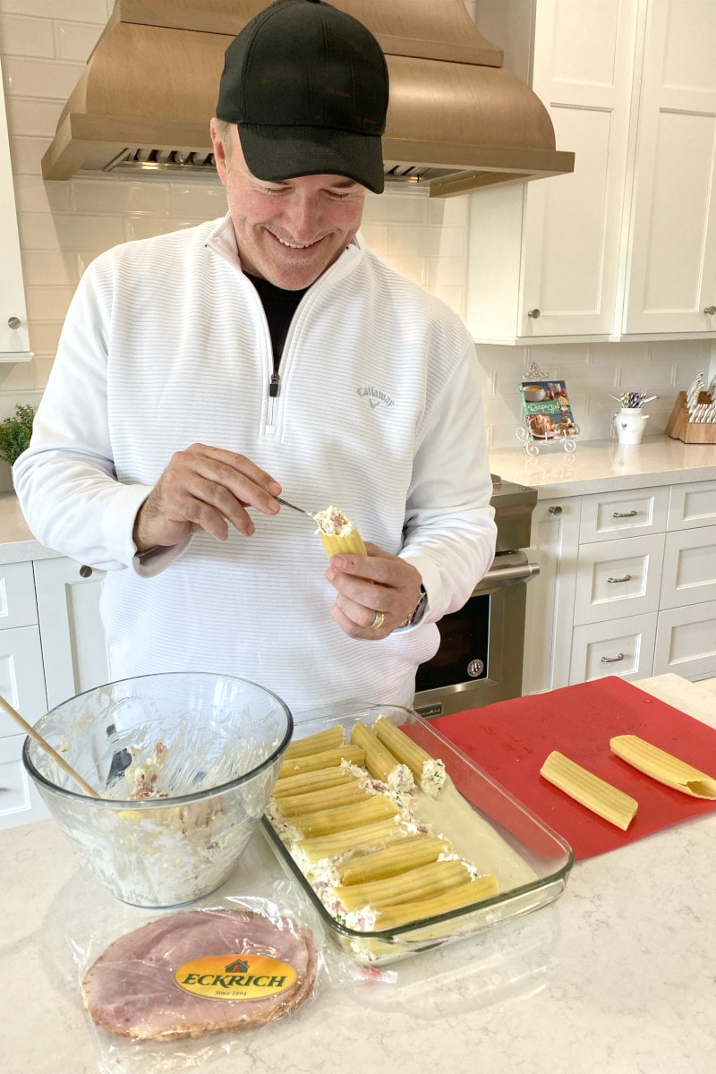 RecipeGirl's husband stuffing manicotti