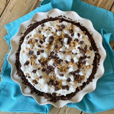 overhead shot of rocky road pie sitting on a teal blue napkin