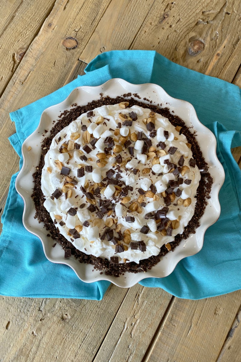 overhead shot of rocky road pie sitting on a teal blue napkin