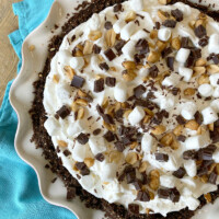 overhead shot of rocky road pie on a teal blue cloth napkin