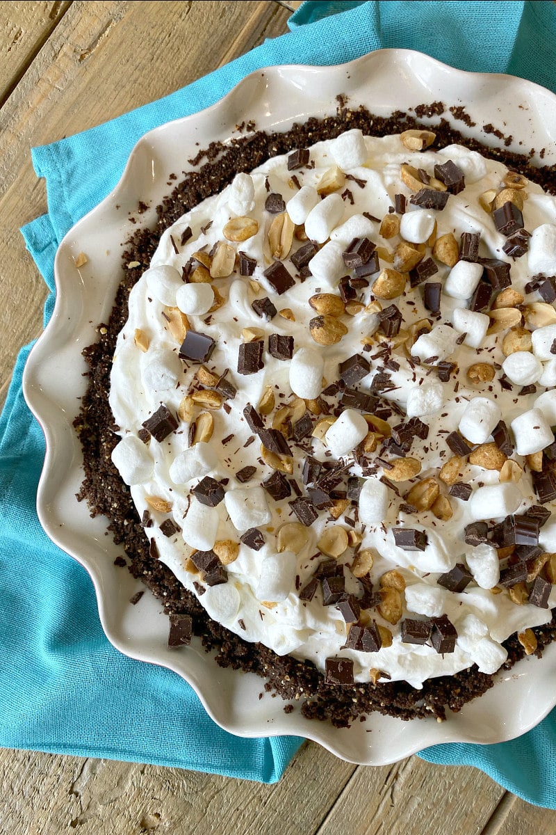 overhead shot of rocky road pie on a teal blue cloth napkin