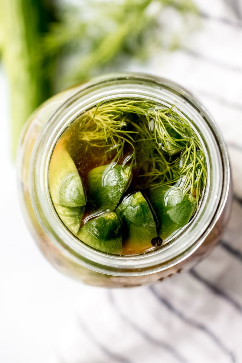 overhead shot of pickles in a jar