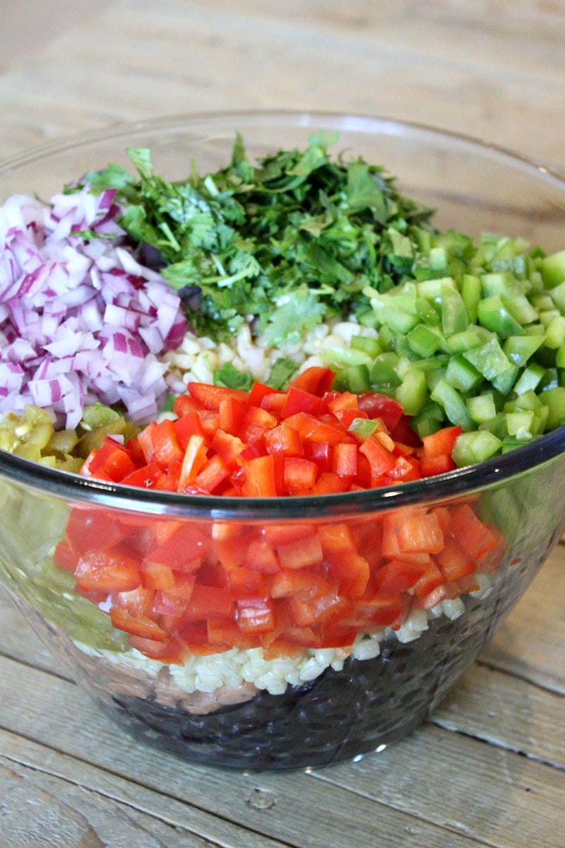 ingredients for texas caviar dip in a glass bowl