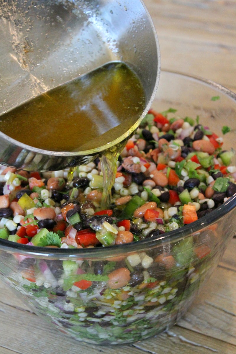 adding dressing to texas caviar