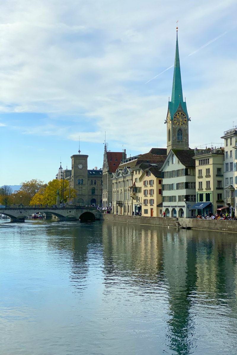 bridge and river in Zurich with buildings in background