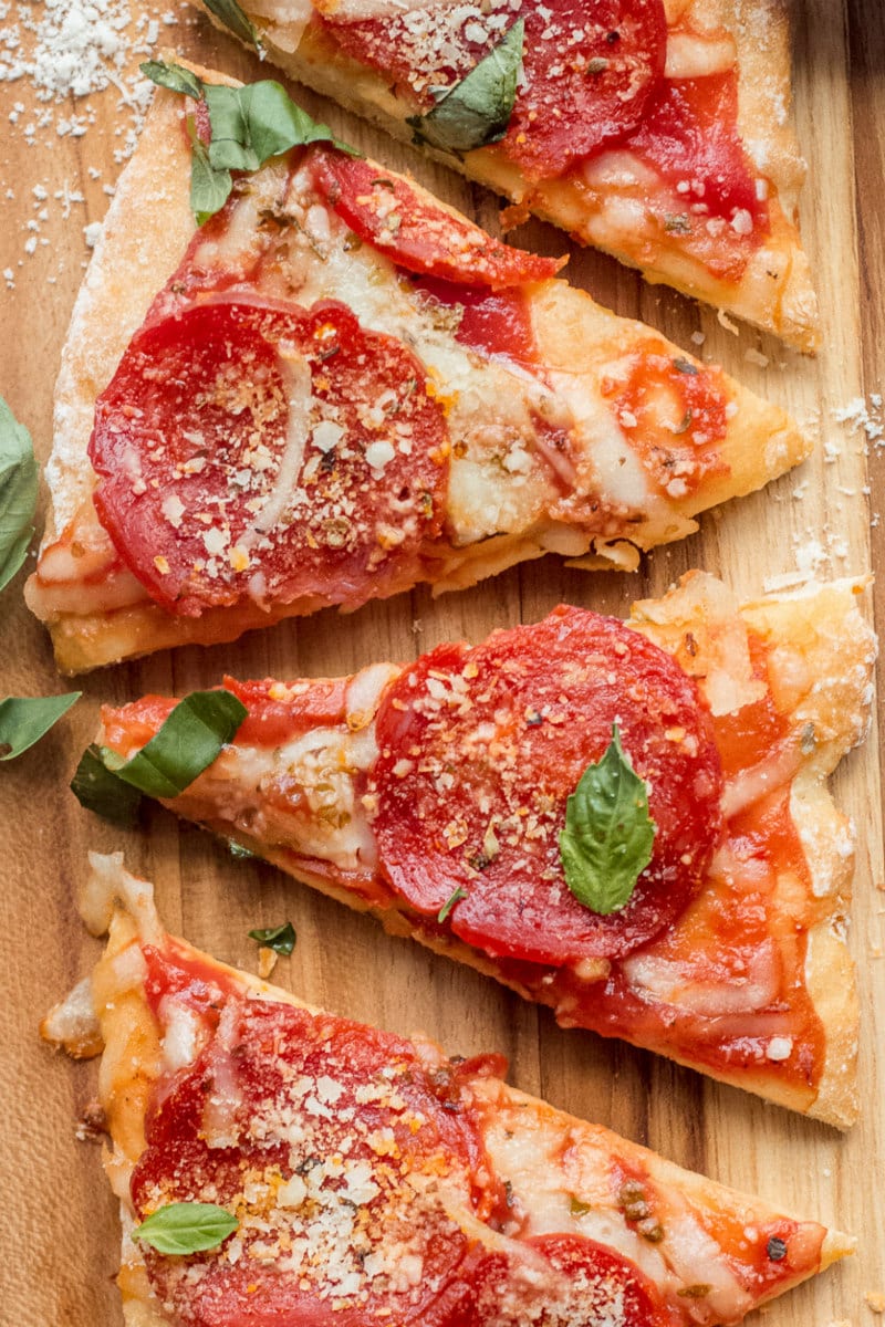 Slices of Weight Watchers pepperoni Pizza on a cutting board