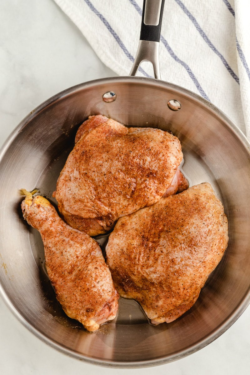 sauteing chicken in a pan