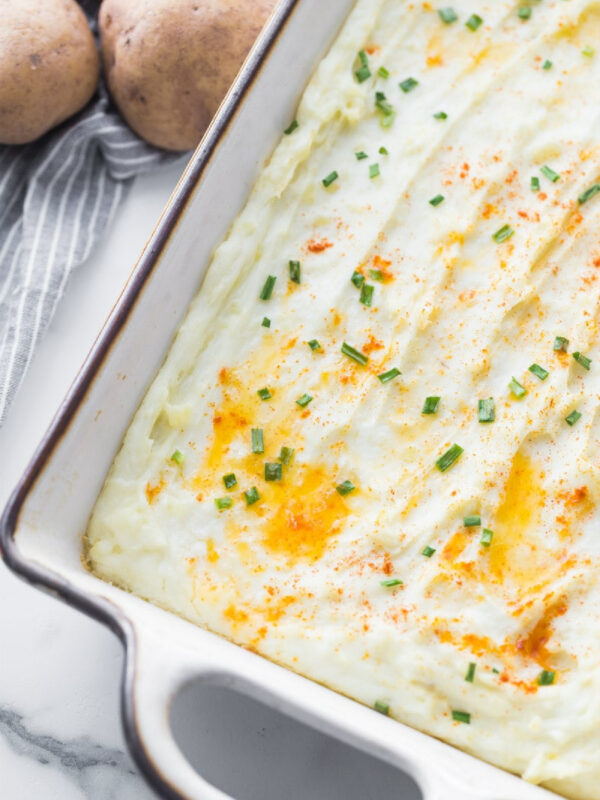 creamy oven baked mashed potatoes in baking dish