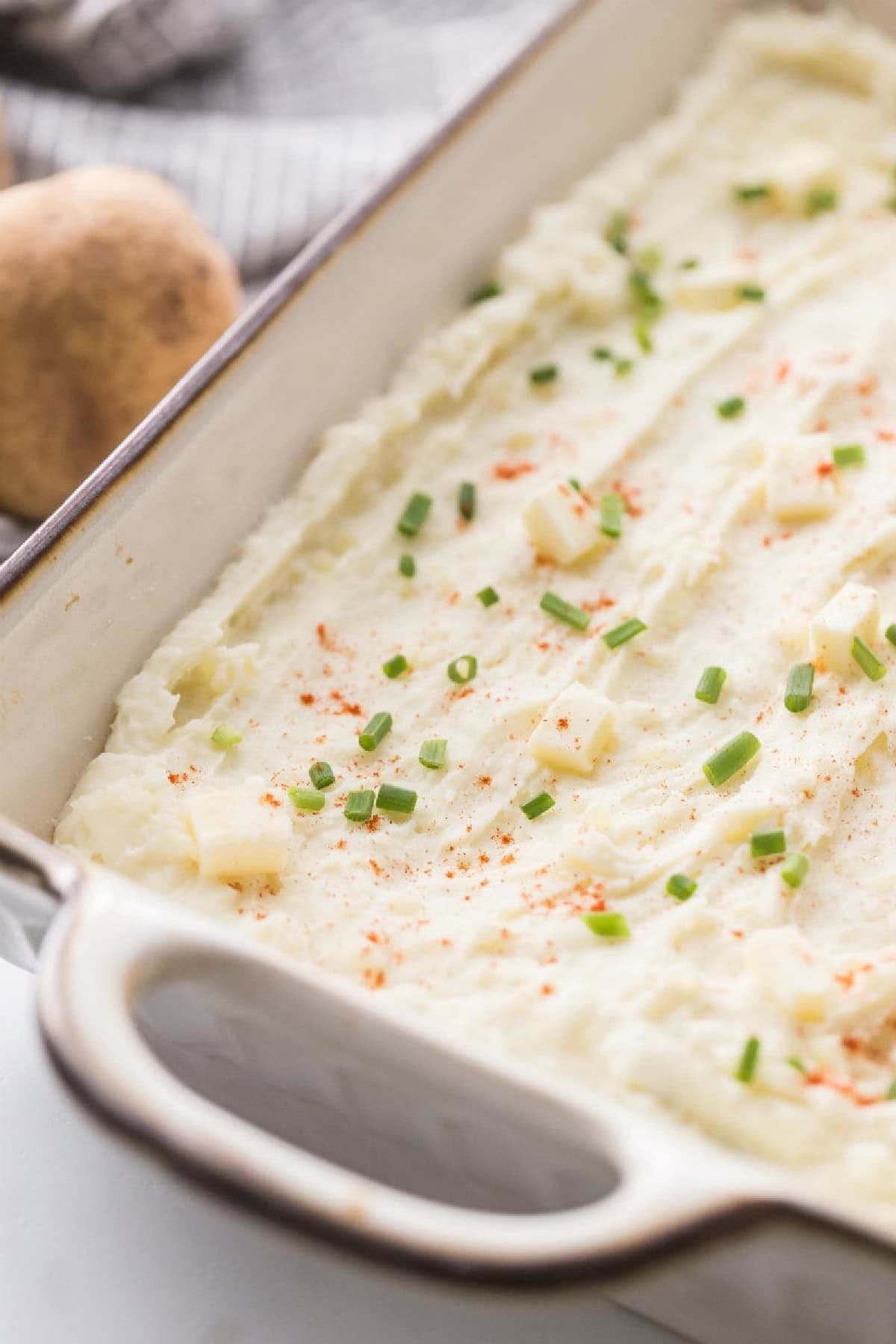 creamy oven baked mashed potatoes in baking dish