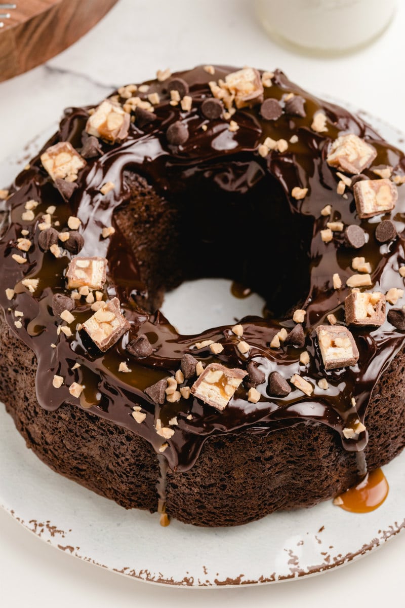 overhead shot of chocolate wasted cake on a white platter