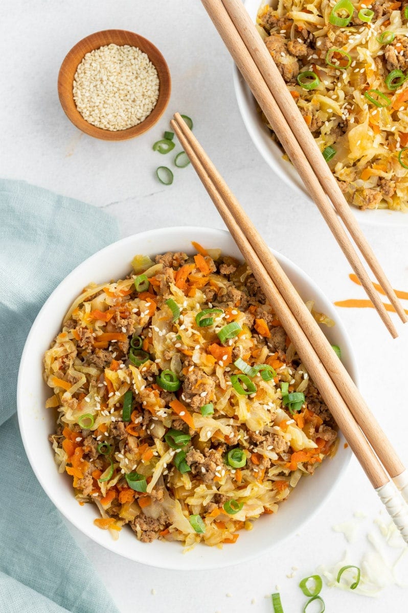 egg roll in a bowl with chopsticks on top