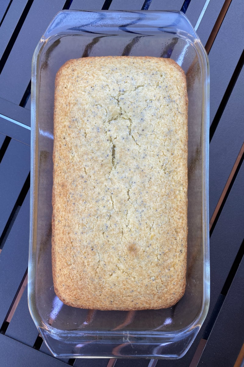 overhead shot of loaf of lemon poppy seed bread in a pyrex pan