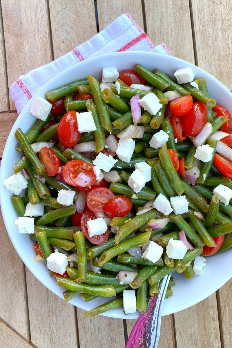 green bean salad in a white bowl