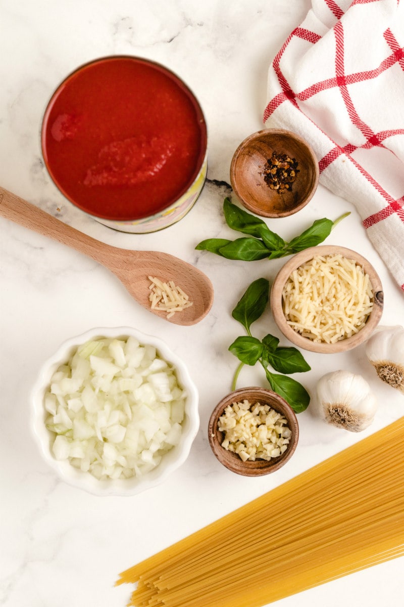 ingredients for pasta pomodoro displayed in bowls