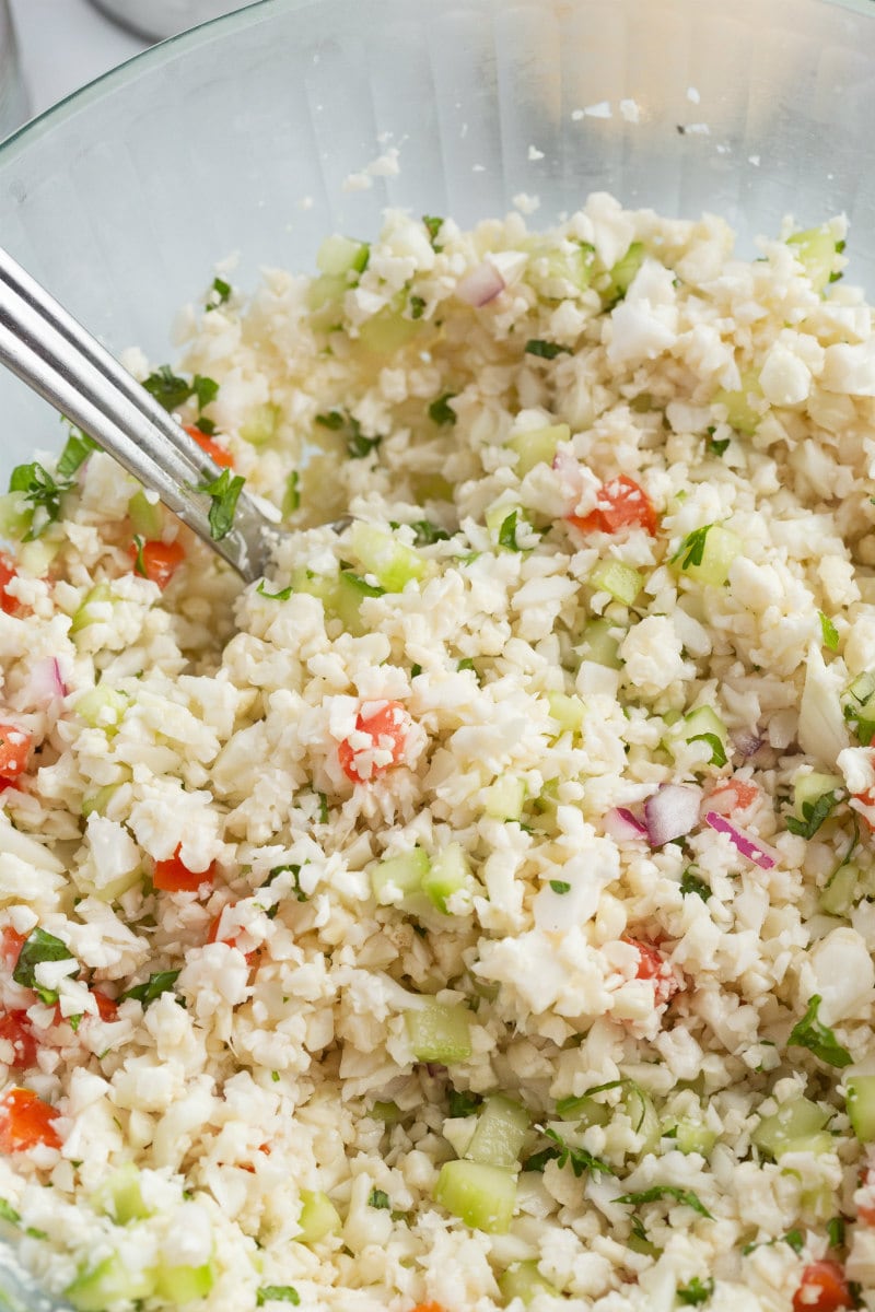 Cauliflower Tabbouleh in a bowl with a spoon
