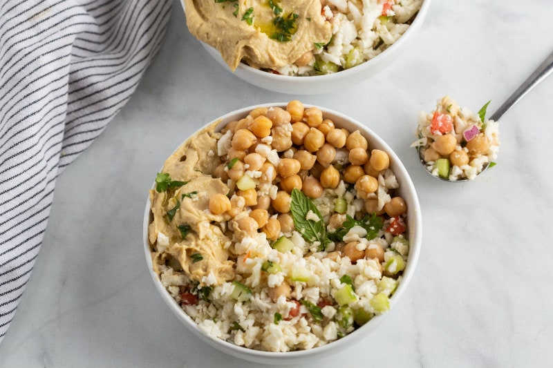 Cauliflower Tabbouleh Bowl with a spoonful sitting alongside