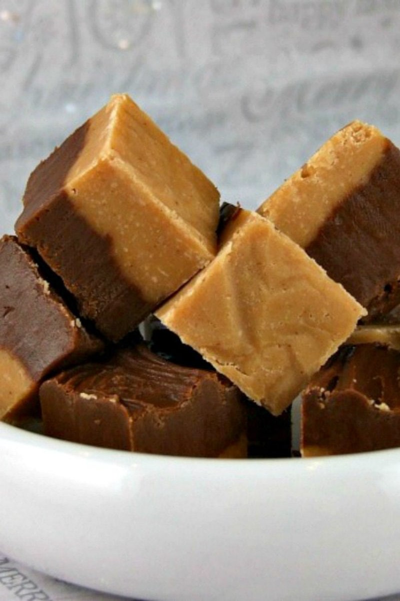 stack of chocolate peanut butter fudge in a white bowl