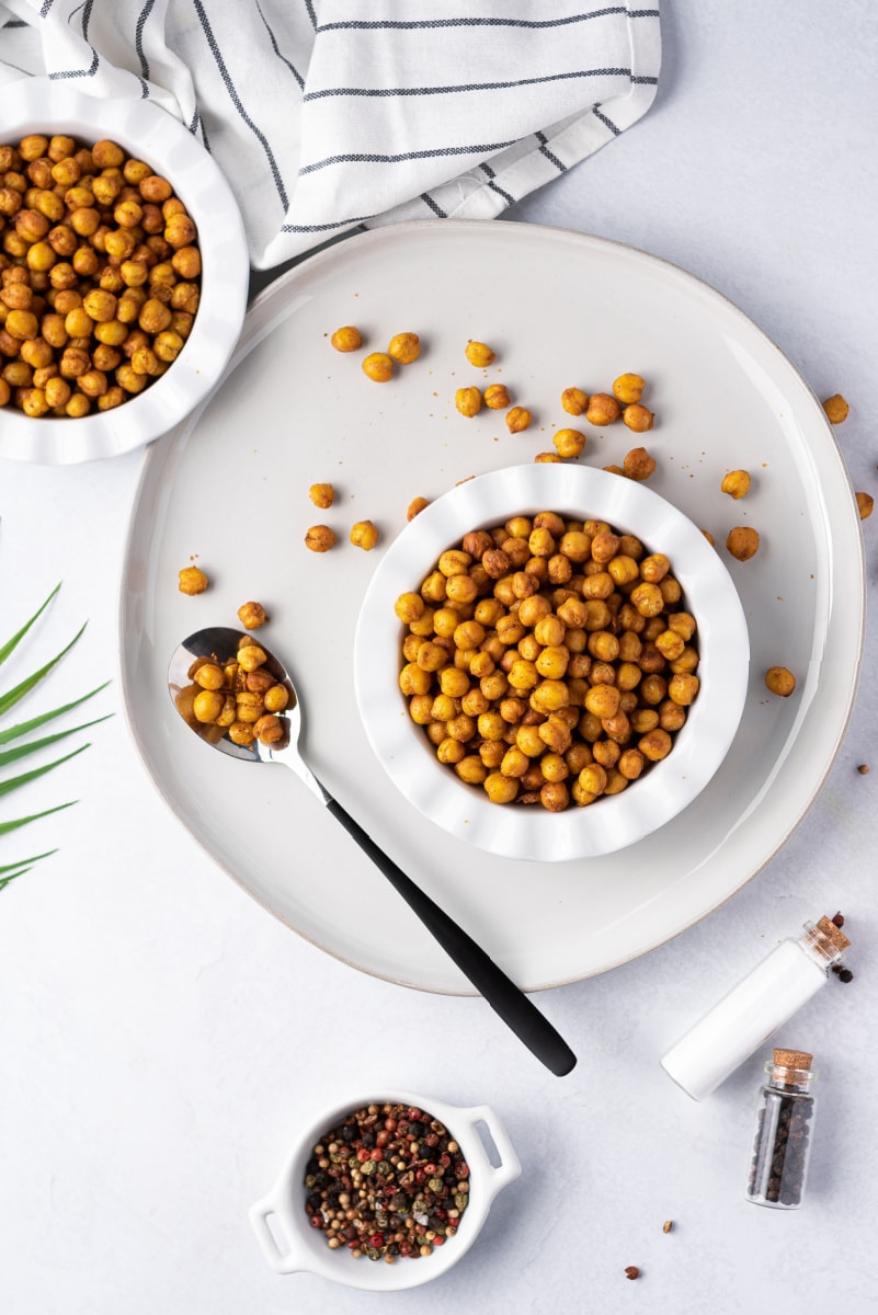 air fryer chickpeas displayed in a bowl with a spoon of chickpeas too