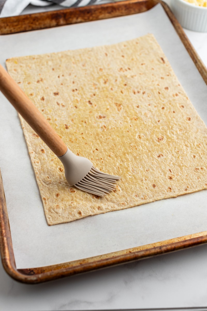 brushing lavash flatbread with oil