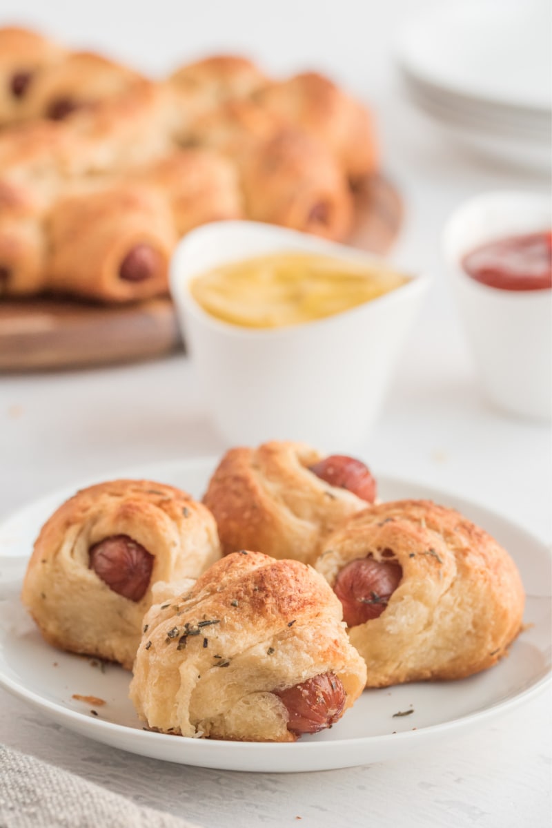 pigs in blanket on white plate