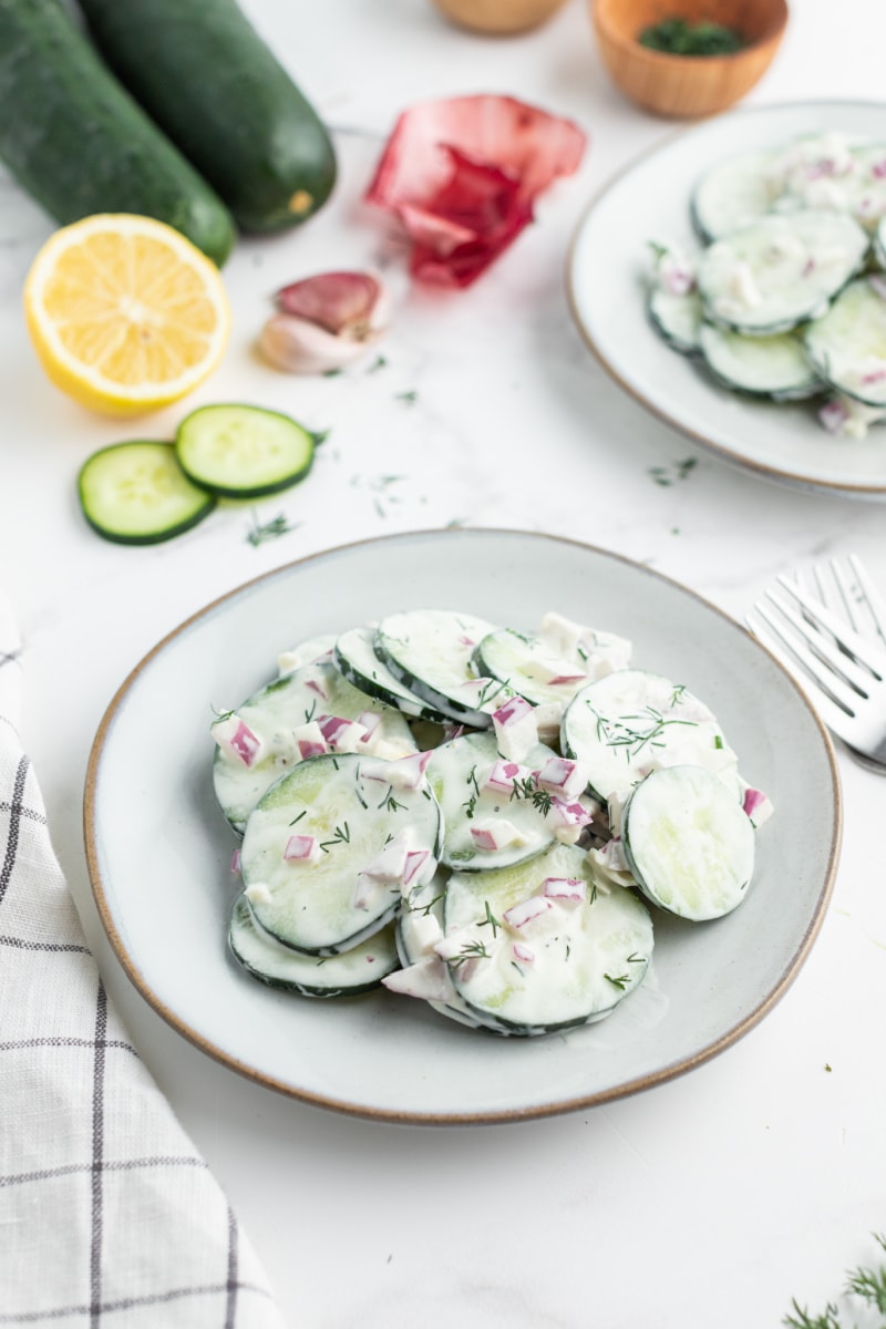 serving of cucumber salad on white plate