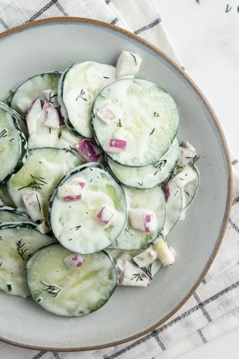 cucumber salad on white plate