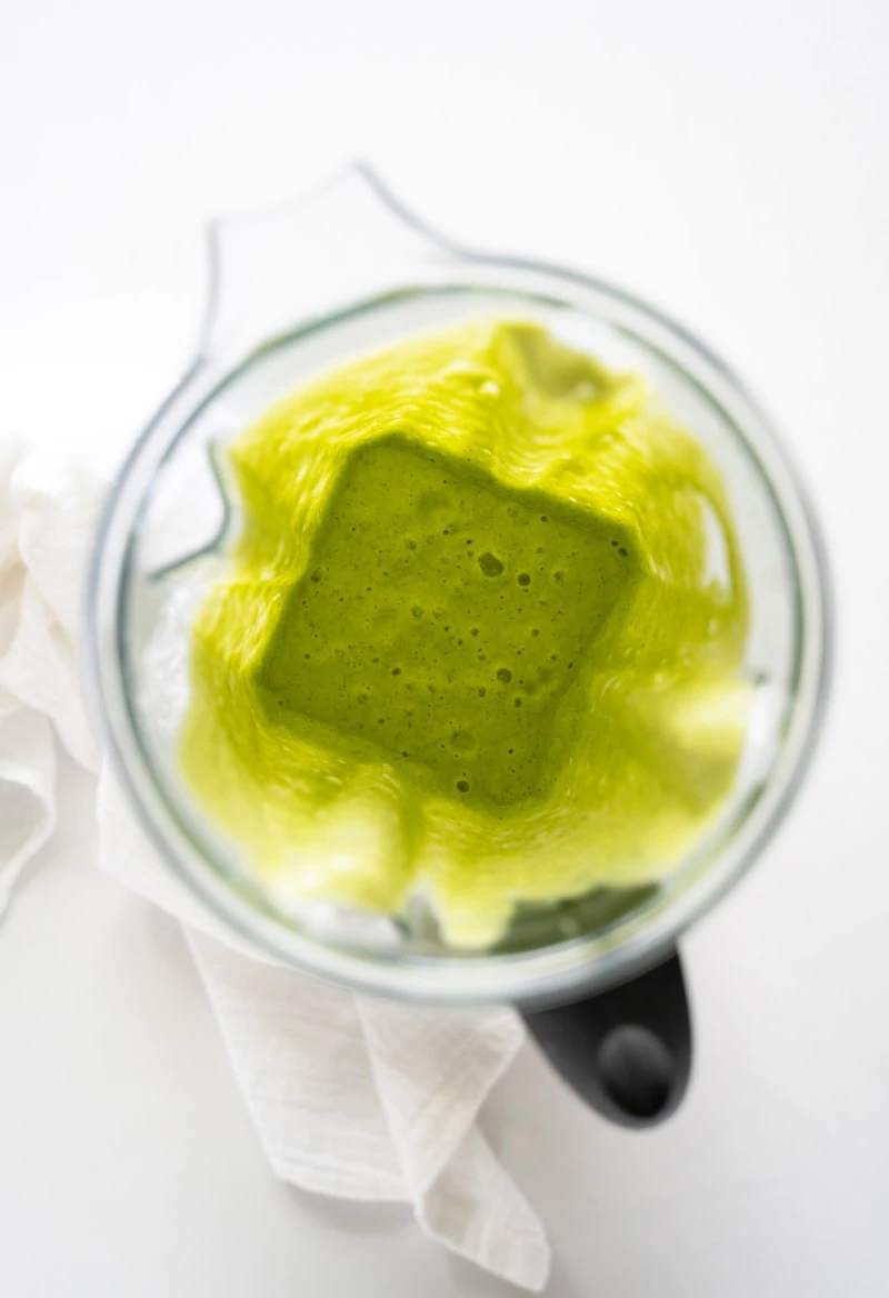 green smoothie blended up in blender