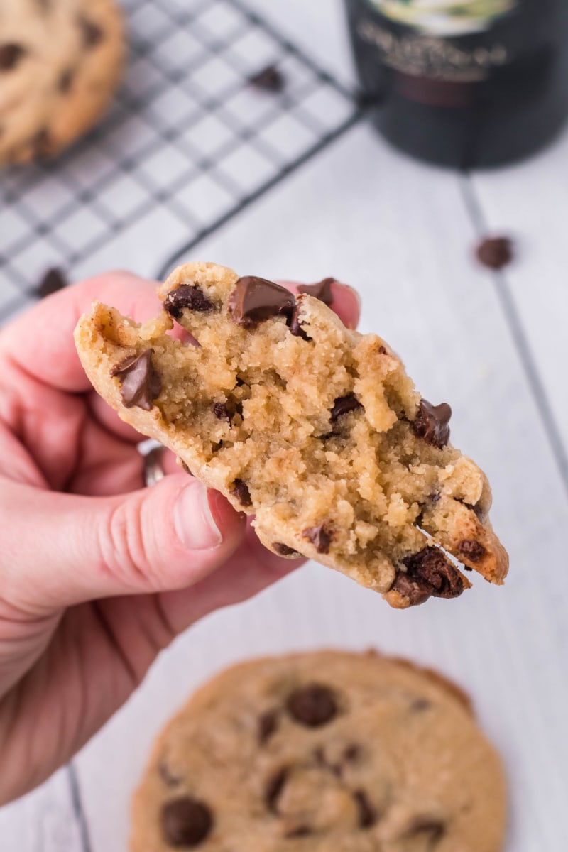 hand showing the inside of a chocolate chip cookie