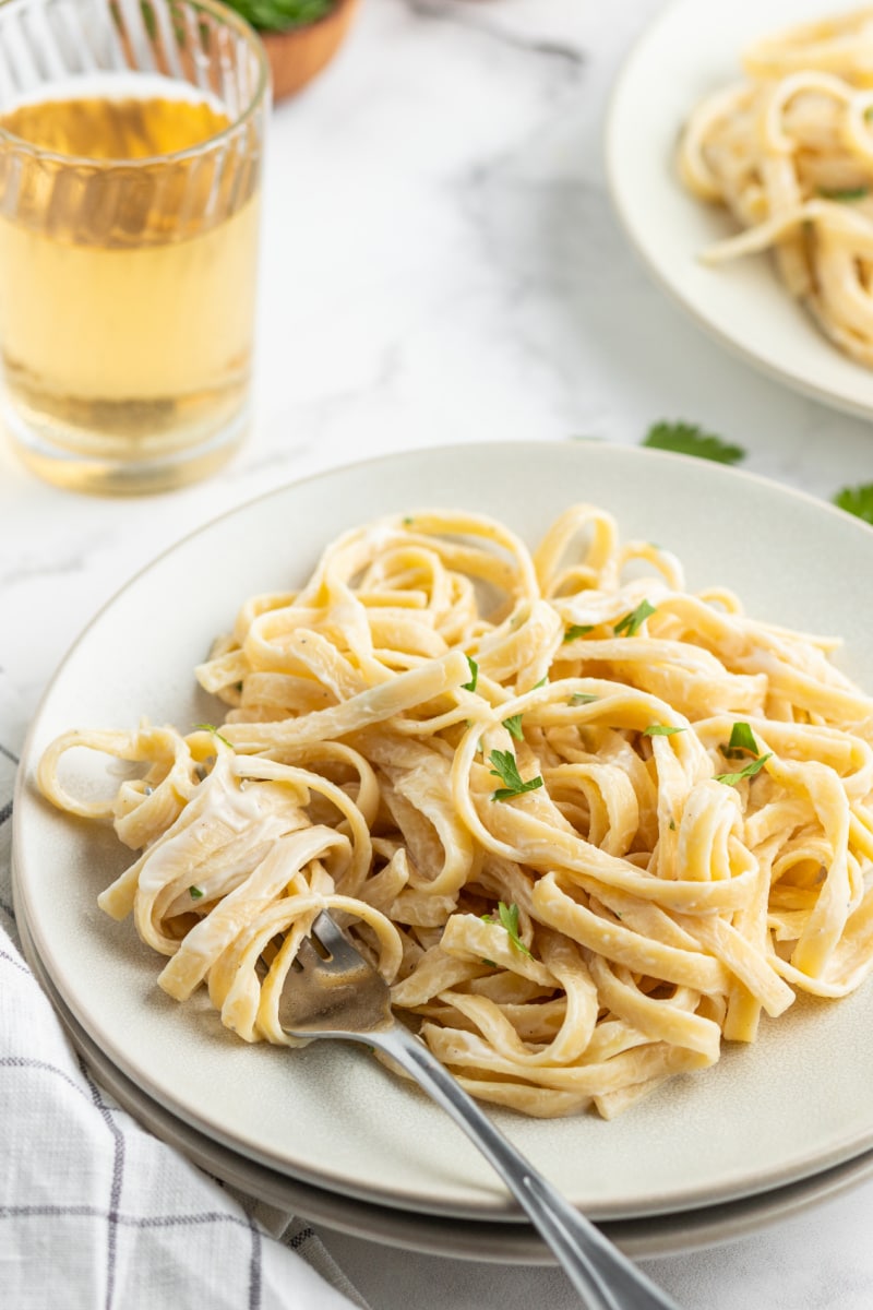 serving of fettuccine alfredo on a white plate