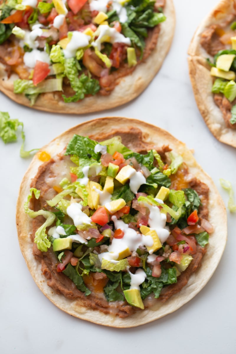 tortilla topped with toppings to make tostada