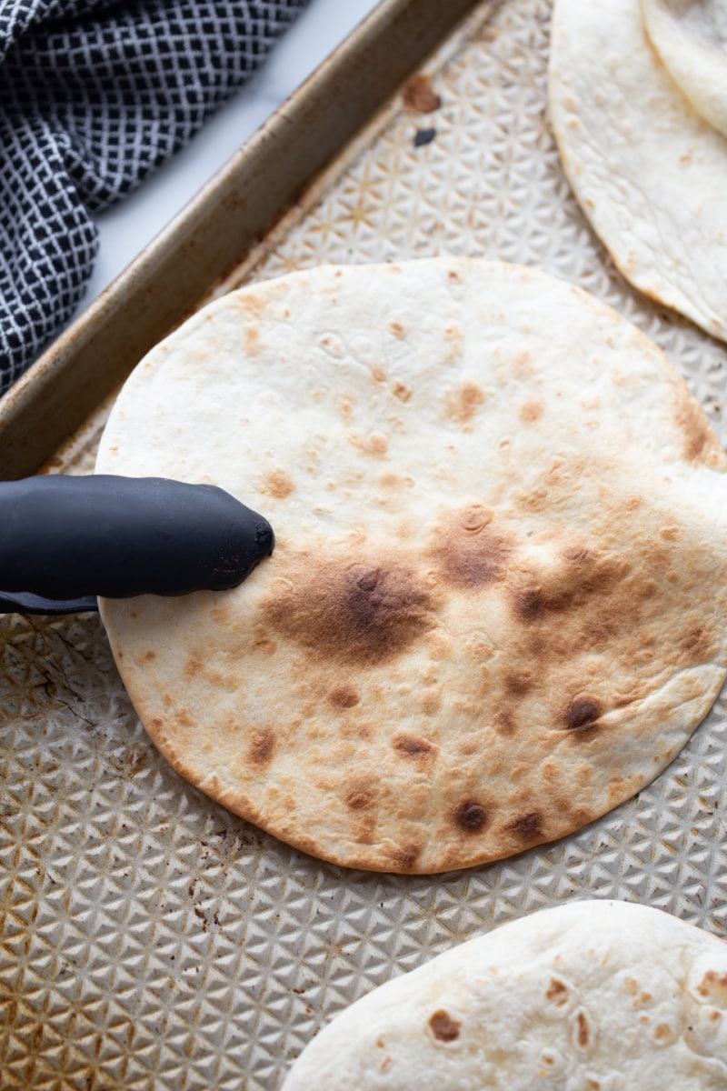 toasting a tortilla in the oven