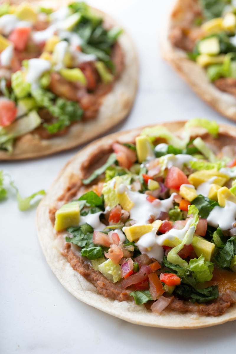tortilla topped with toppings to make tostada