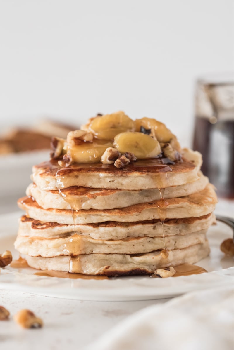 stack of pancakes with sauteed bananas on top