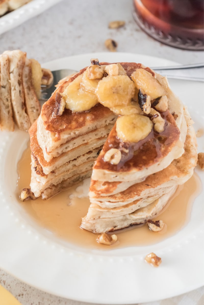 stack of banana bread pancakes with big slice taken out