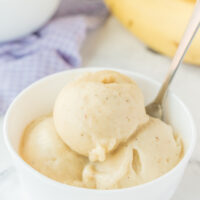 scoops of banana ice cream in a white dish