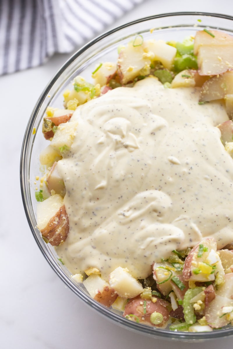 dressing added on top of potato salad