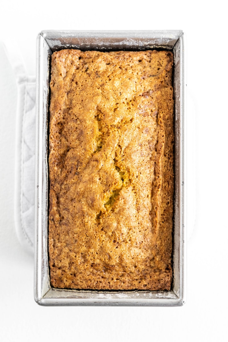 loaf of lemon zucchini bread in loaf pan