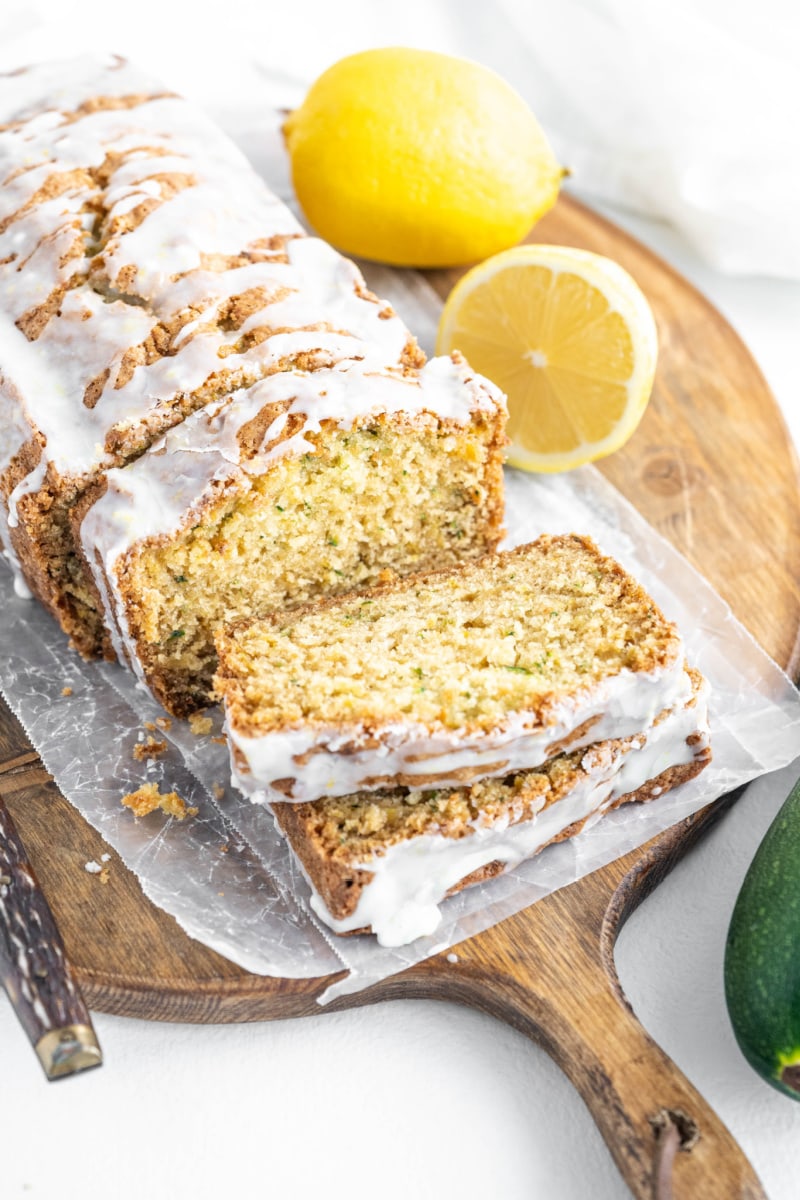 loaf of iced lemon zucchini bread sliced