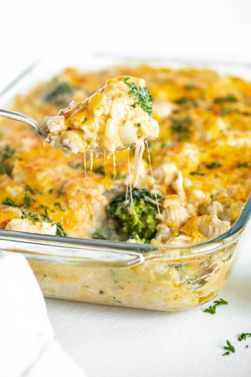 spoonful of chicken and rice casserole lifting out of dish