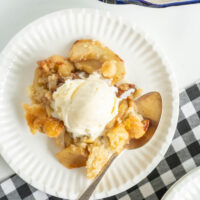serving of apple cobbler with ice cream on top